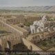 Hisham’s Palace, The Town of Jericho and the Ancient Tell of Jericho in Background, Umayyad Period, around 730 AD, Looking South-SW - Archaeology Illustrated